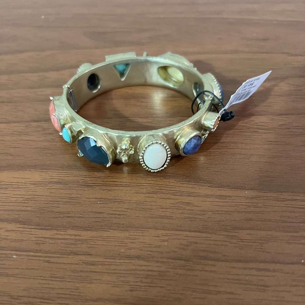 NEW WITH TAGS.  Gold tone bangle bracelet.